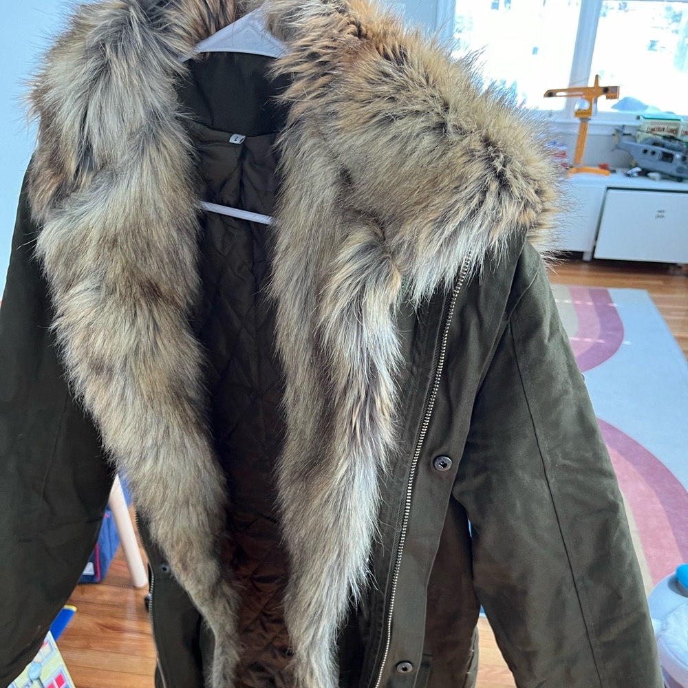 Olive green jacket with fur lining and hood